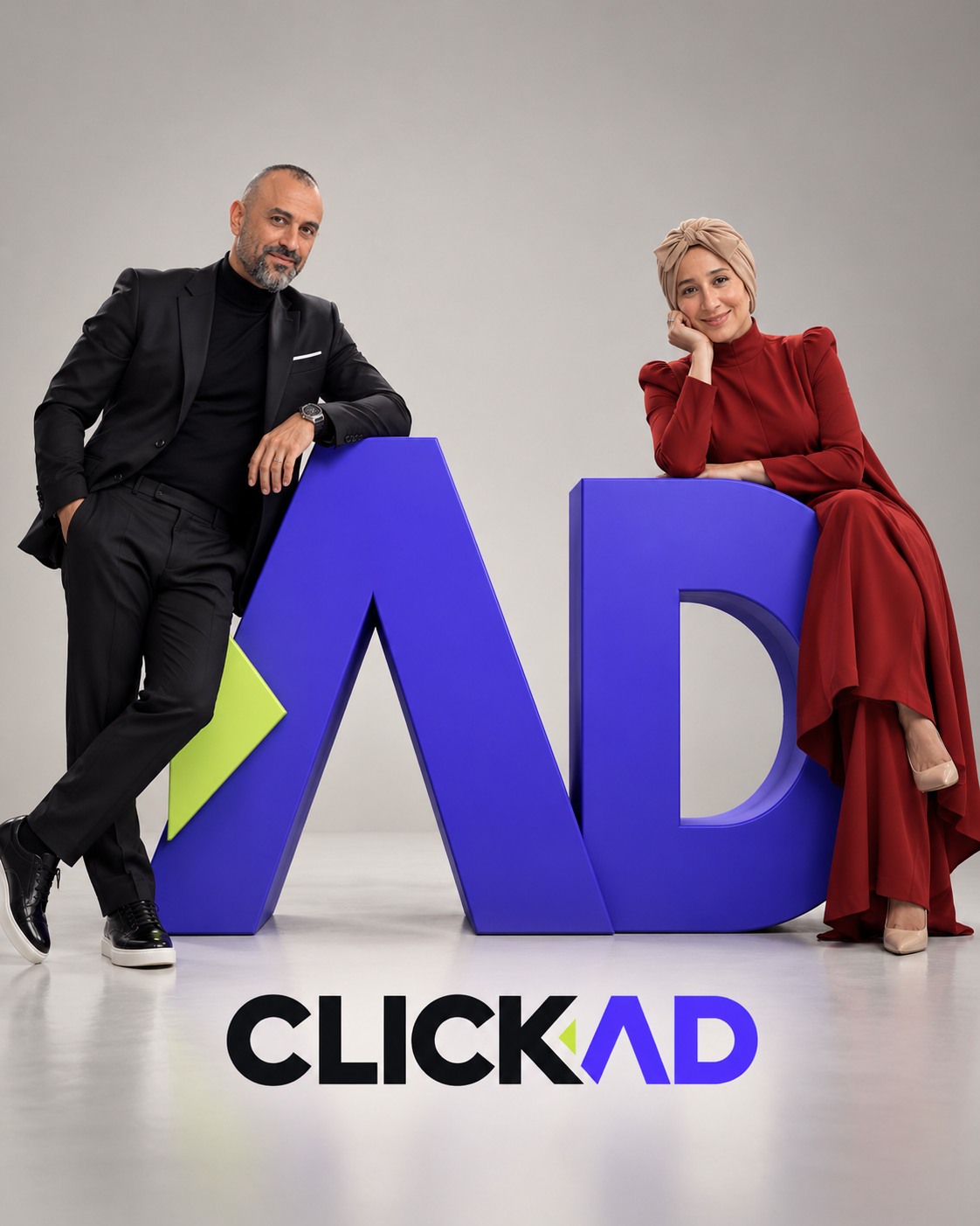 Kamel Aouina and Wafa Hasnaoui beside the ClickAD letters in a studio